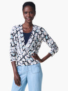 4-way cardigan; light blue, black, and beige tie-dye pattern;  long sleeves; wrap style.