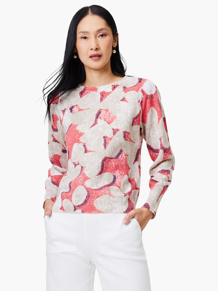 Beige sweater with coral and purple abstract print.  Long sleeves, crew neck.