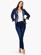 Navy blue knit jacket with white and navy trim, fringed edges.