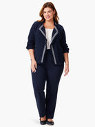 Navy blue knit jacket with white trim and fringe detailing.  Open front.