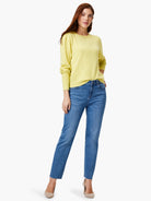 Pale yellow round neck sweater with gathered long sleeves.
