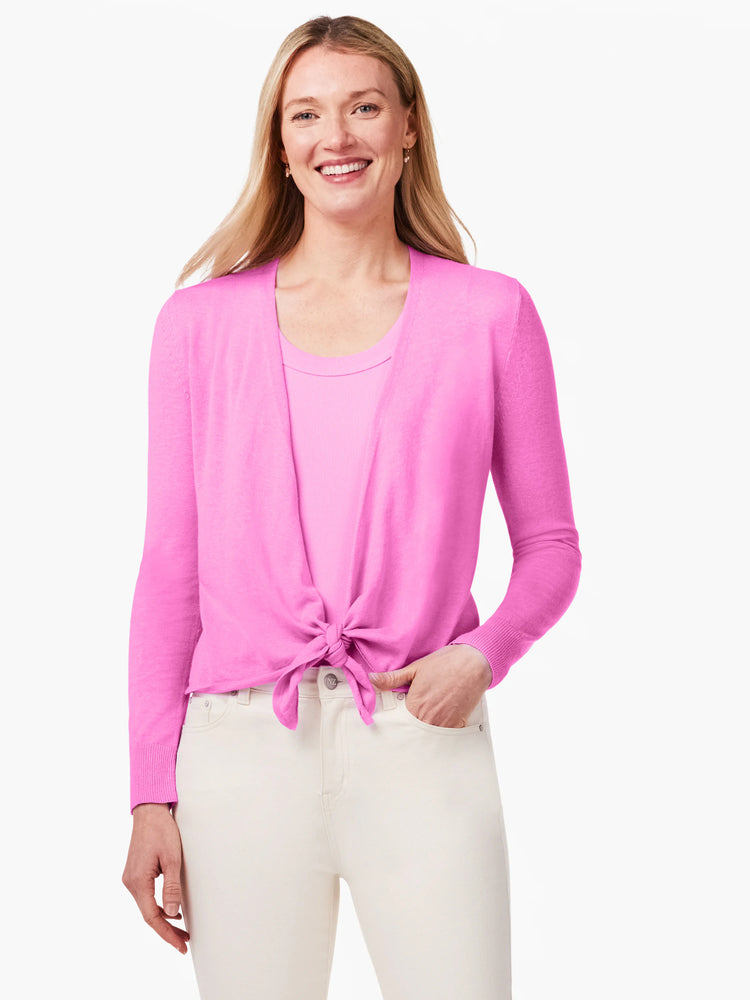 Bright pink open cardigan, long sleeves, tied at waist, worn over a lighter pink tank top.