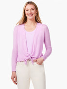 Light pink long-sleeve cardigan with an open front, tied in a knot at the waist.