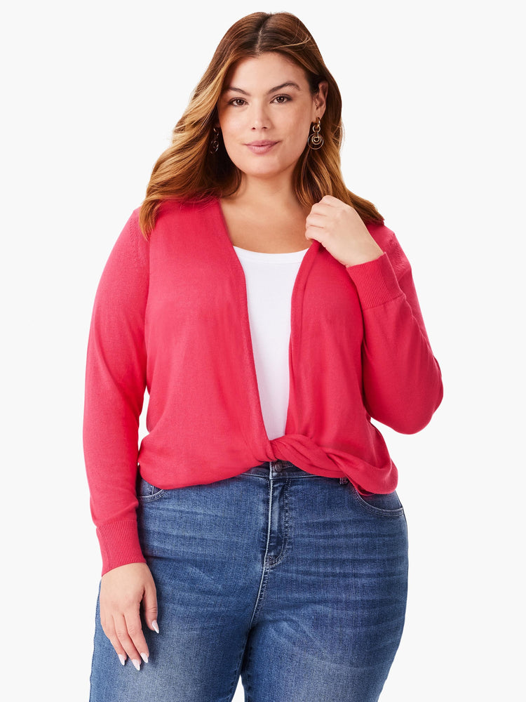 Bright pink knit cardigan with ribbed cuffs, tied in a front knot.