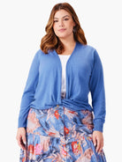 Light blue, open front, long sleeve cardigan tied at the waist.