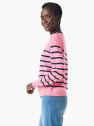 Pink cashmere sweater with dark-blue horizontal stripes and button details on shoulders.
