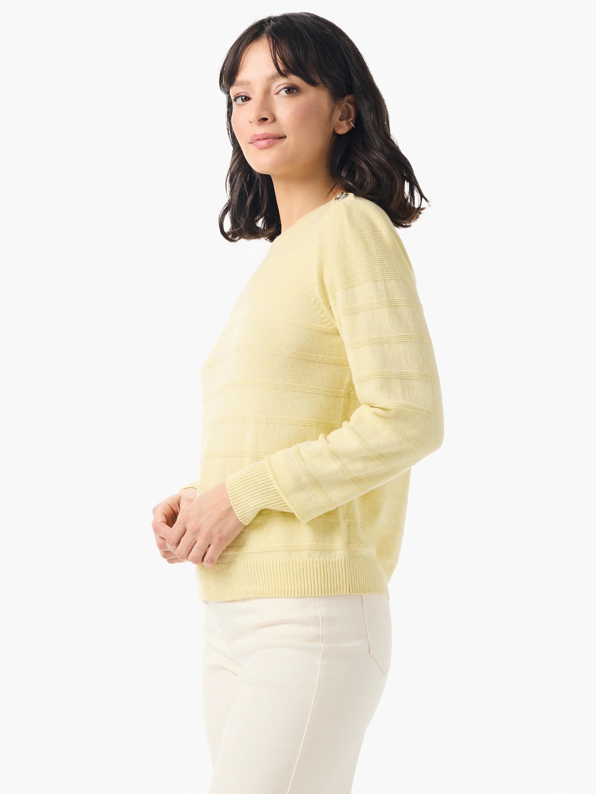 Pale yellow, long-sleeved cashmere sweater with subtle horizontal stripes and button details on the shoulders.