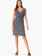 Black and white geometric print sleeveless knee-length dress with a knotted waist detail.