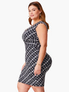 Here's alt text for the image, keeping it concise and accessible:

"Midnight Shibori dress, black and white pattern,...