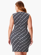 Here's alt text for the image, under 125 characters:

"Black and white sleeveless dress.  Small, repeating pattern....