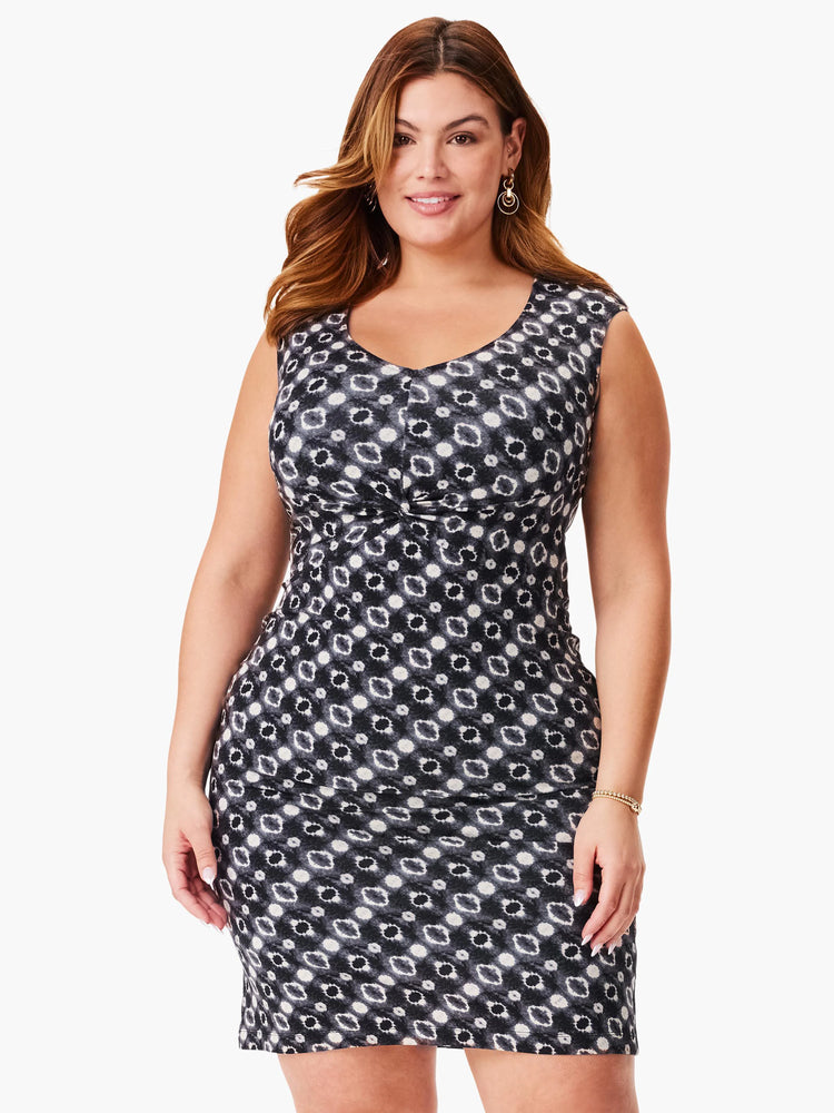 Black dress with a gray and white shibori pattern, sleeveless, fitted bodice, and a twist detail at the waist.