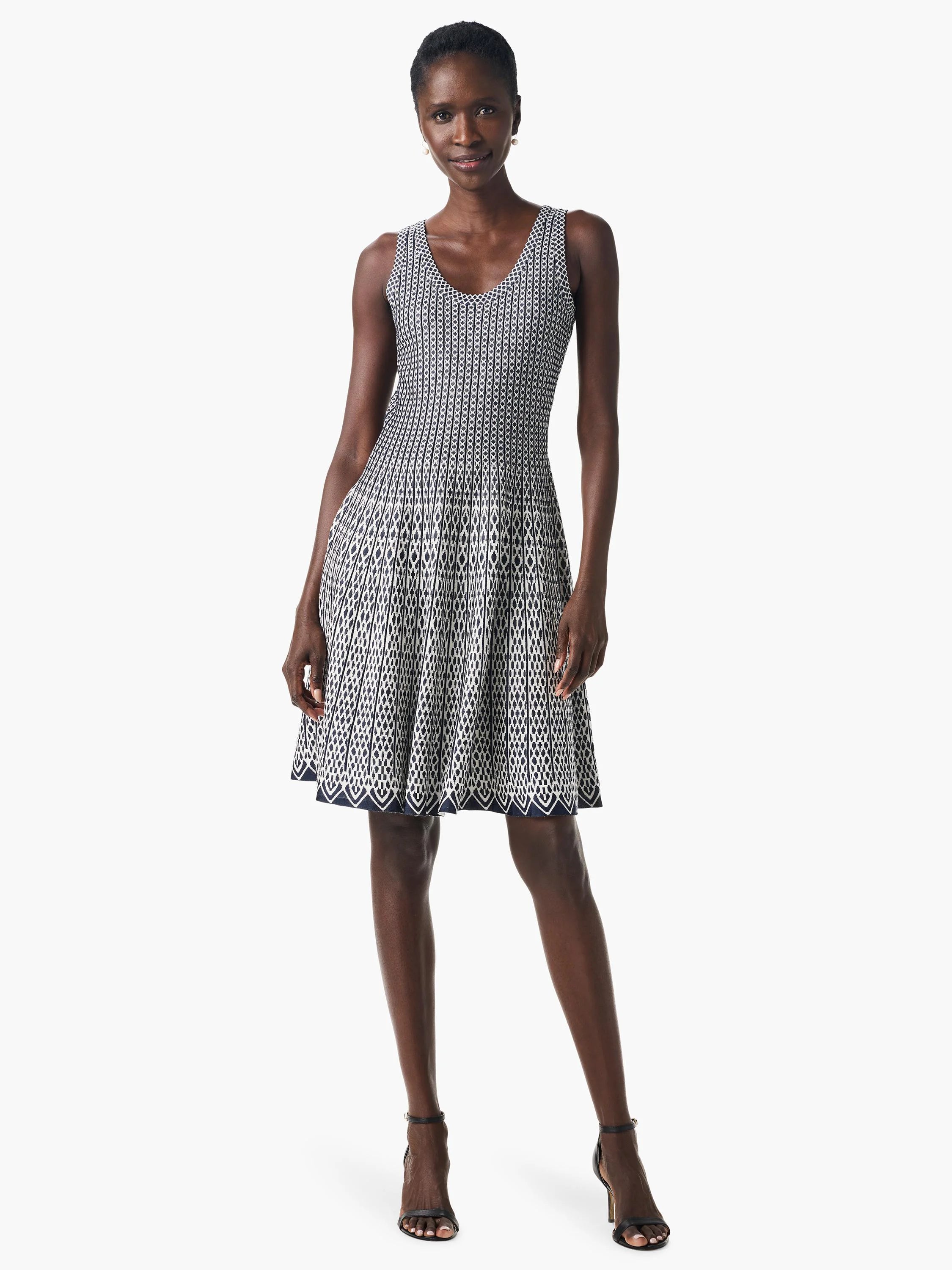 Sleeveless, navy and white geometric patterned fit-and-flare dress.  The pattern is predominantly vertical stripes with a...