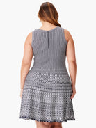 Black and white patterned sleeveless fit-and-flare dress.  Back view shows a centered zipper.