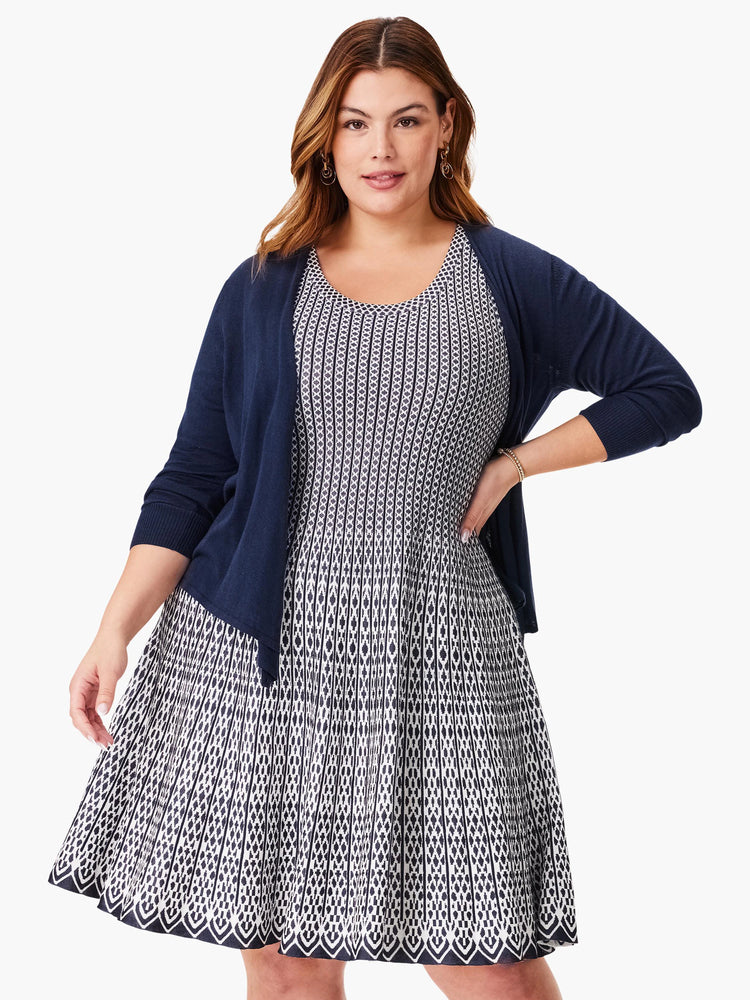 Navy blue and white patterned fit-and-flare dress.  The pattern is a repeating geometric design.  A matching navy...