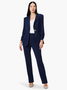 Navy blue blazer, single button, scrunch sleeves.  Model also wears navy pants.