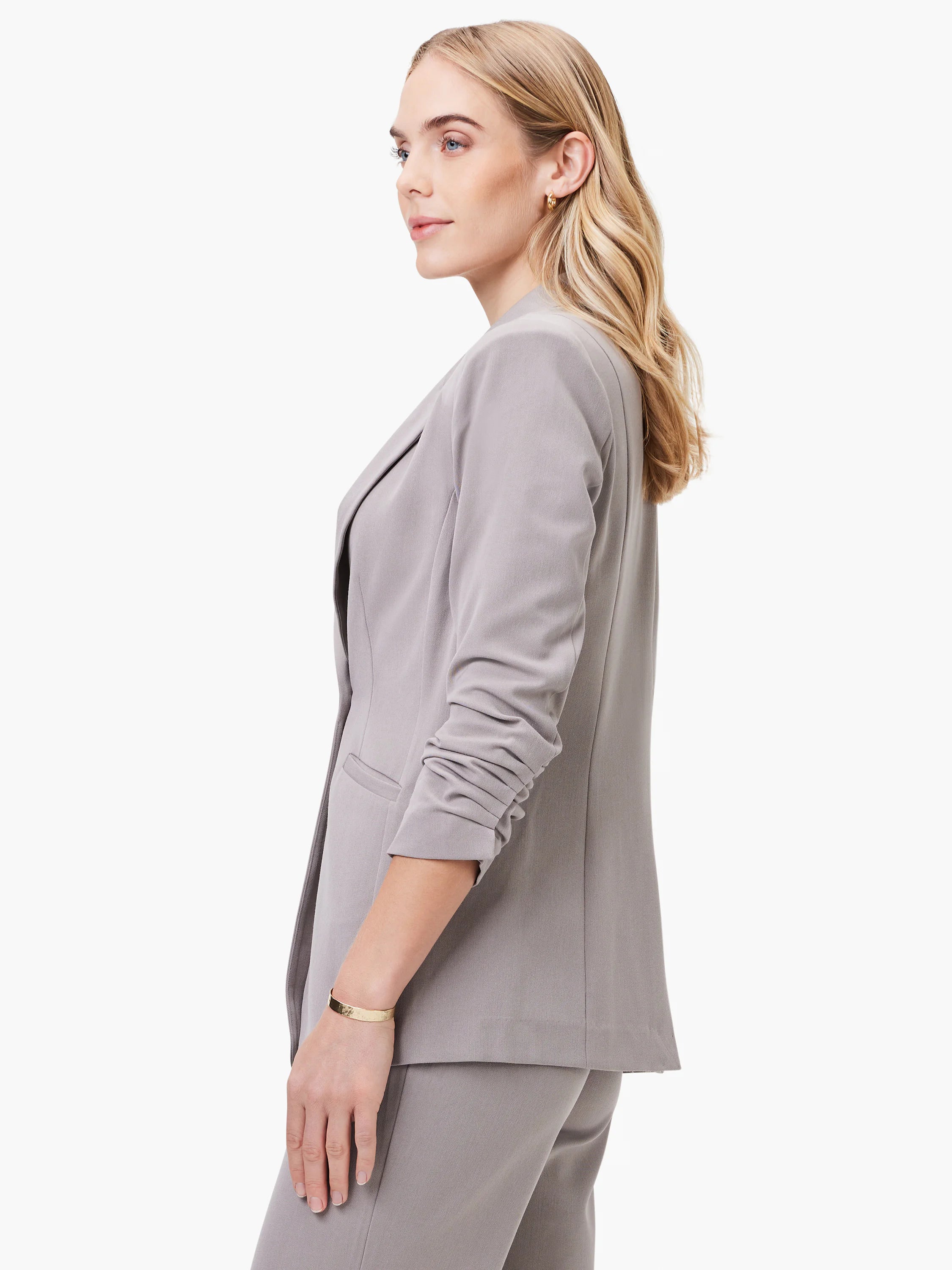 Taupe blazer, scrunch sleeves, open front.  Side profile view.