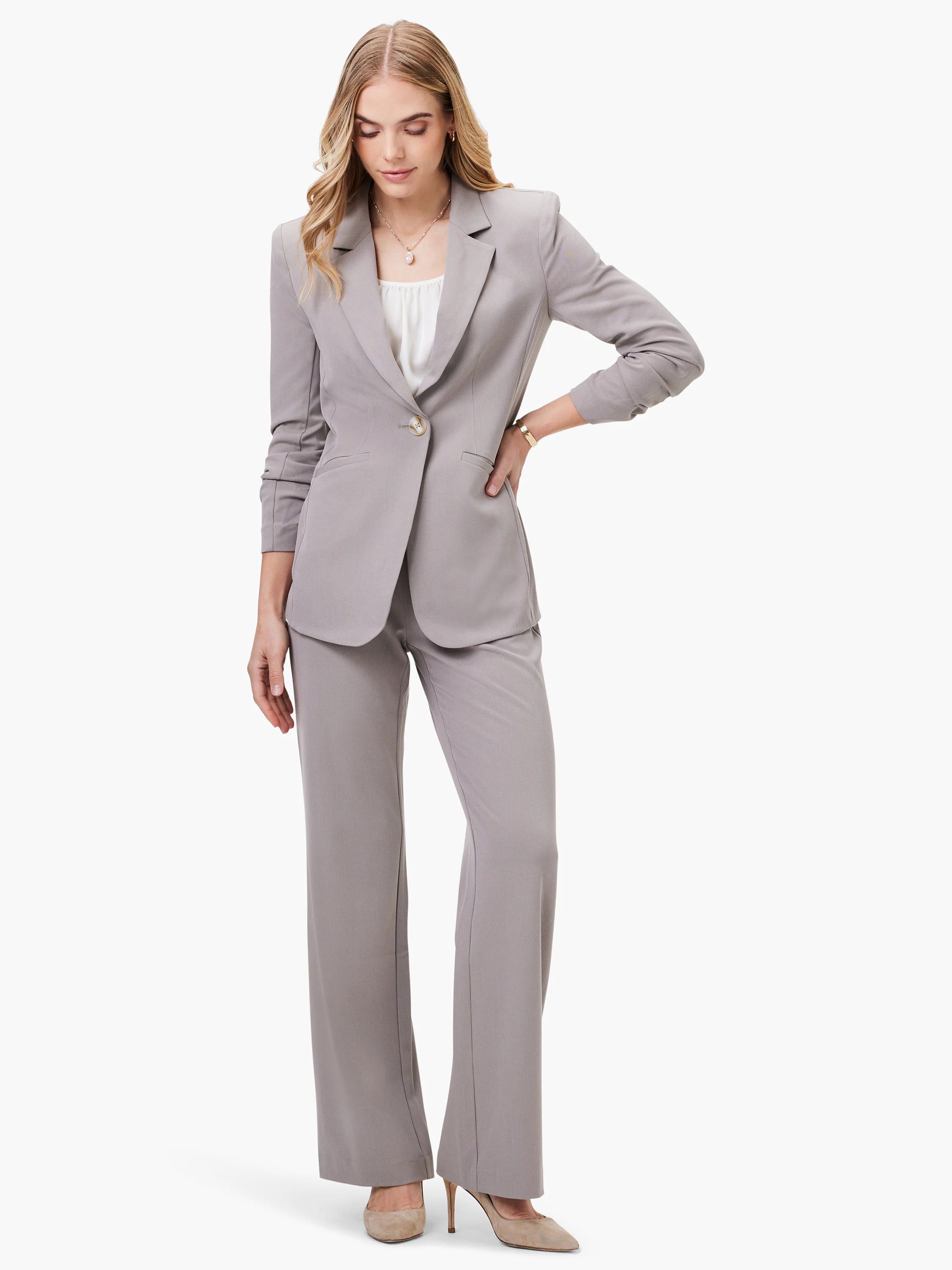 Gray single-button blazer, 3/4 sleeves, worn with gray pants.  Model shown for scale.
