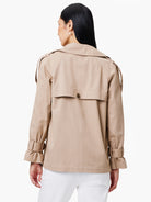 Beige trench coat, belted sleeves, single button closure at back.  Relaxed fit.