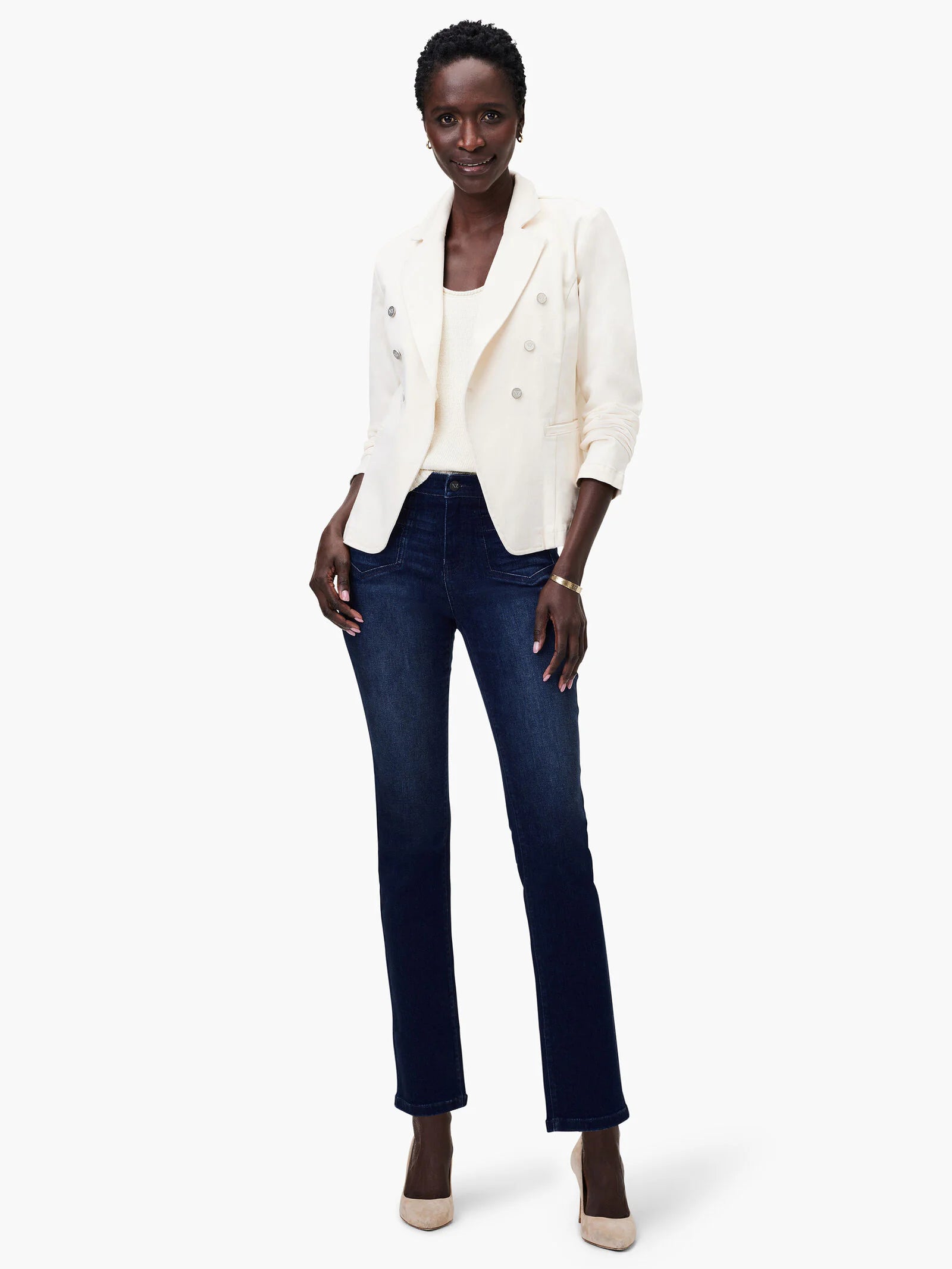 Off-white denim blazer, double-breasted with metallic buttons, modeled over a cream top and dark-wash jeans.