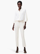 Off-white satin chiffon shirt; long sleeves with slight puff at shoulder; button-down front.