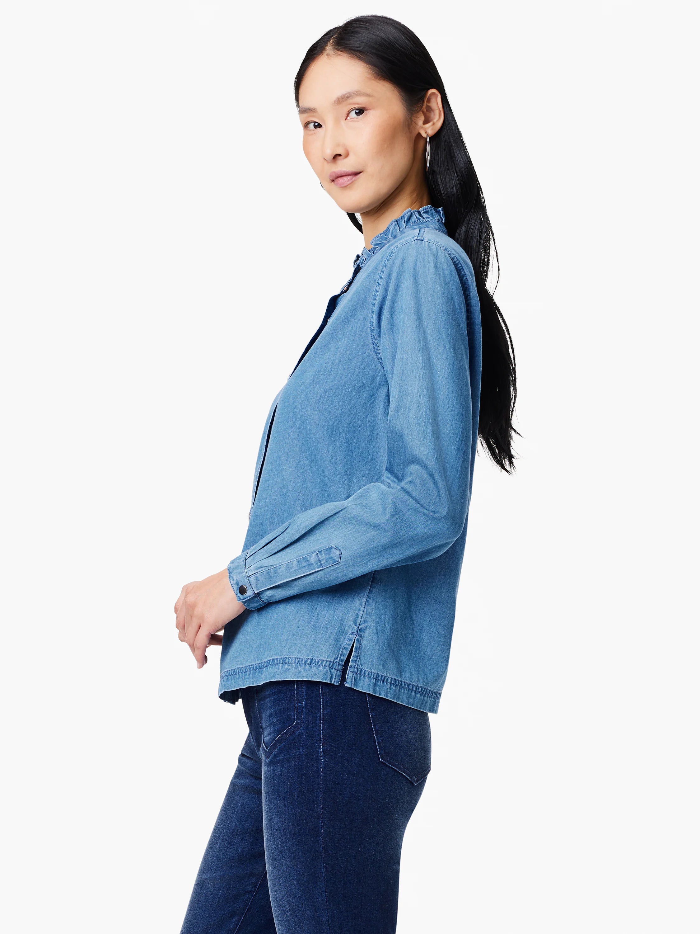 Light blue denim shirt, ruffled collar, long sleeves, button cuffs.
