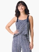 Navy blue tank top with off-white diagonal stripes and navy blue straps.