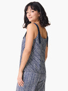 Navy blue tank top with off-white diagonal stripes and dark navy straps.