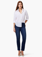 White button-down cotton shirt with rolled sleeves, an open collar, and a rounded hem.