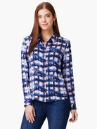 Long-sleeved collared shirt in navy blue with a lighter blue and peach abstract print.