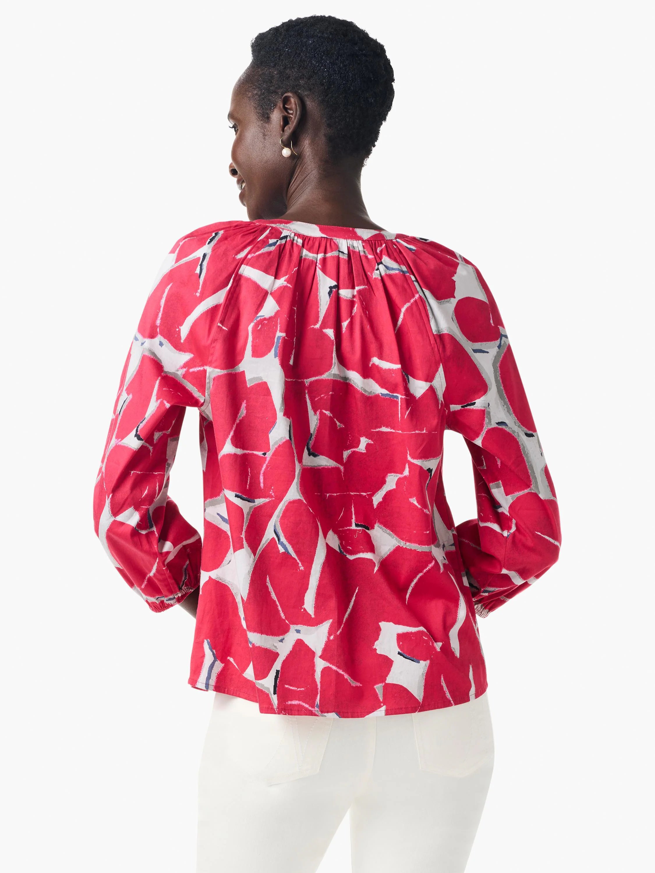 Red shirt with an abstract print in gray and white.  Three-quarter sleeves, V-neck.