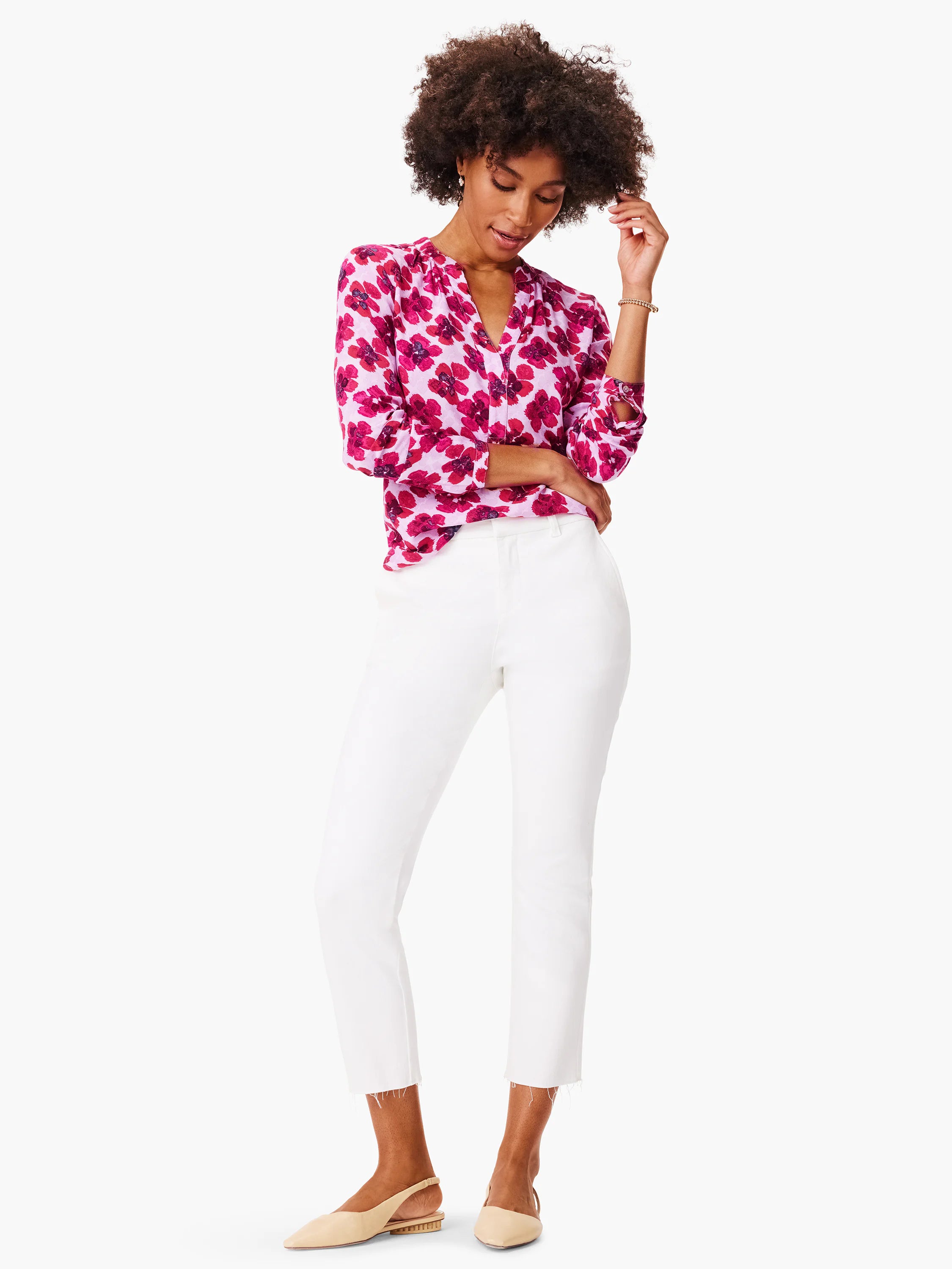 Pink top with dark pink floral print, long sleeves, and v-neck.