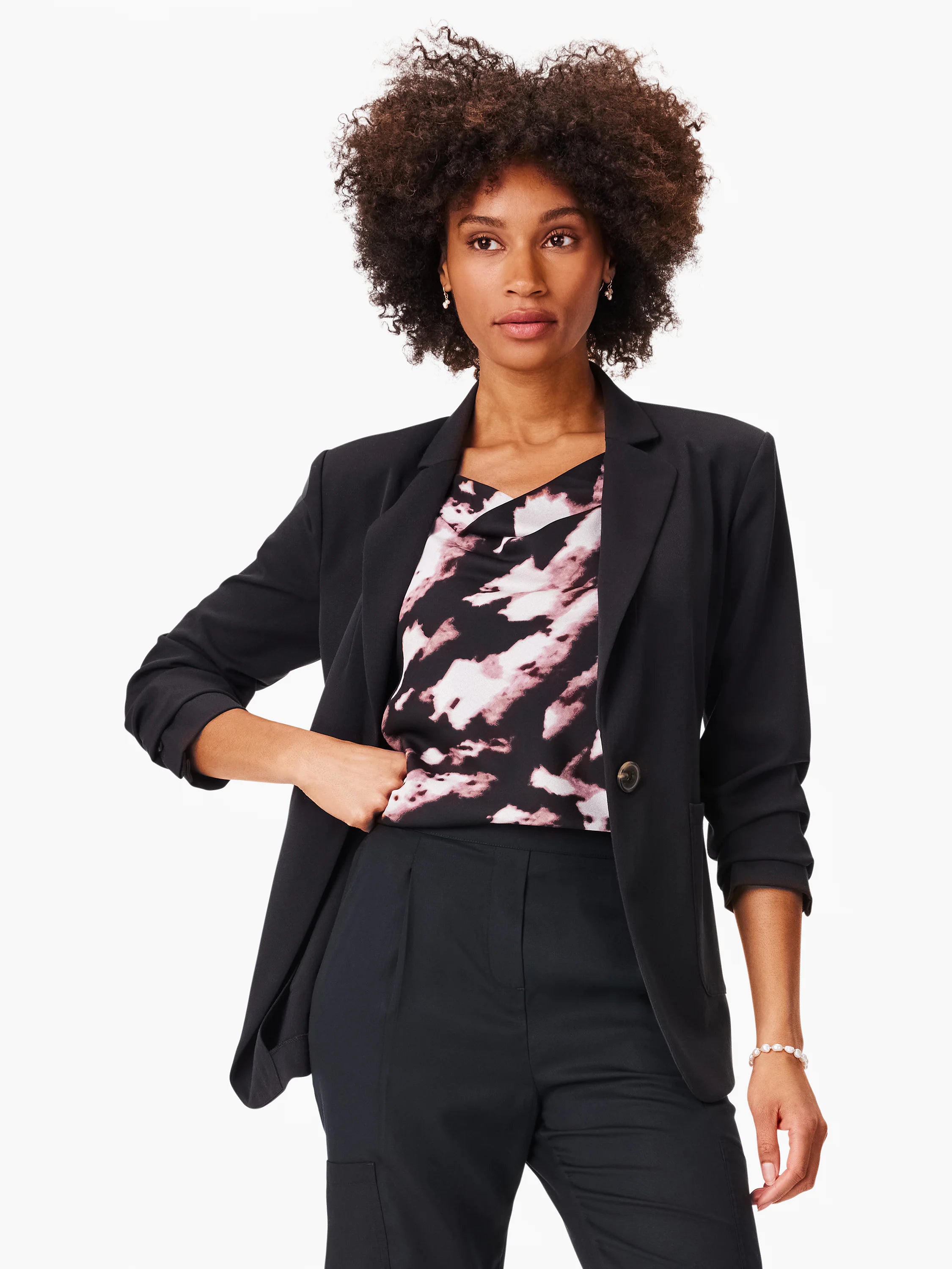 Black blazer, mauve and black tie-dye top, black pants.  Model is wearing the items.