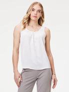 Off-white scoop neck tank with subtle gathering below the front neckline.