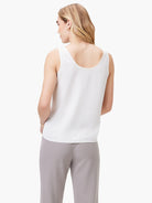 White scoop-neck tank top, shown from the back. Sleeveless and loose-fitting.