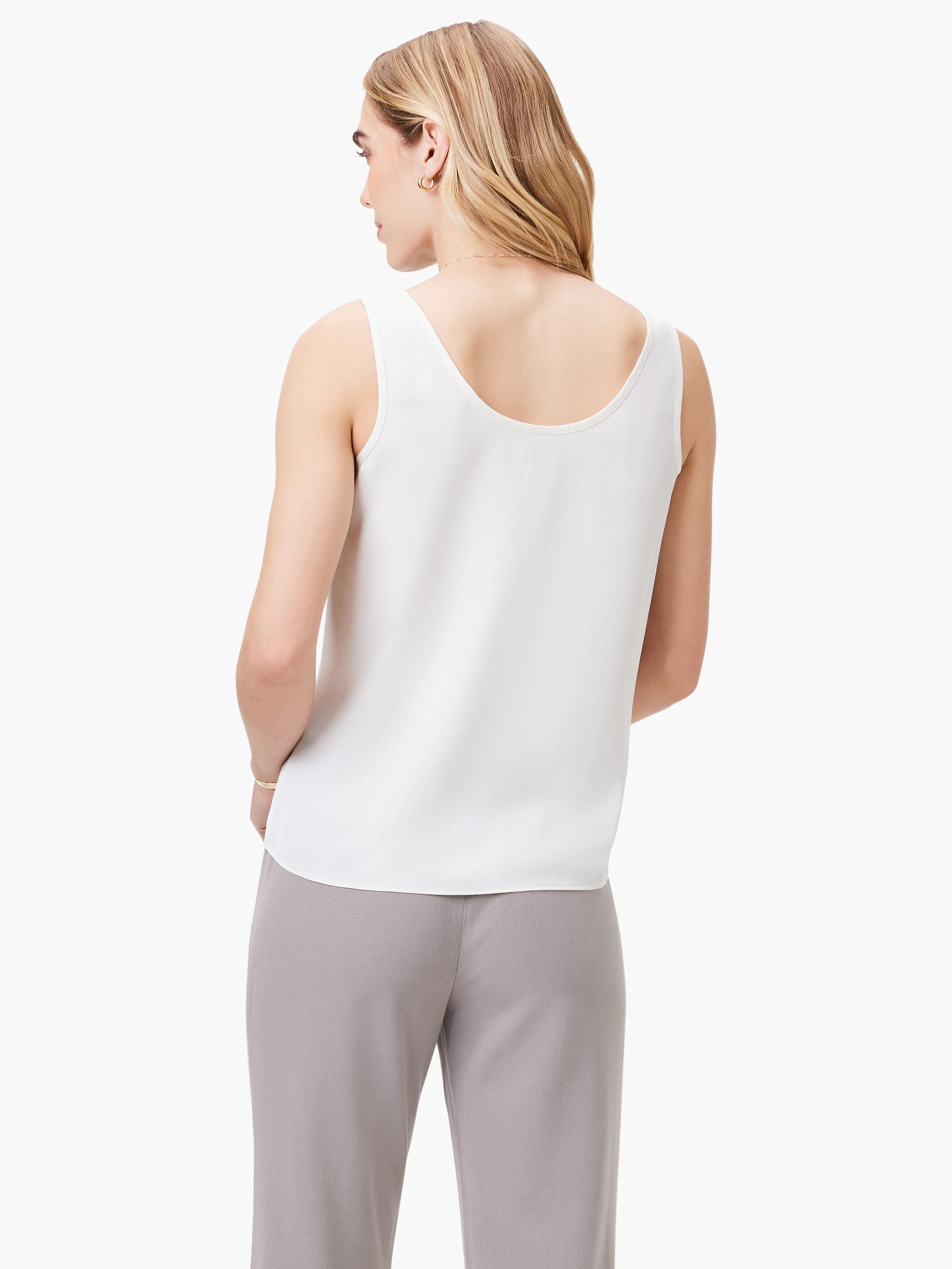 White scoop-neck tank top, shown from the back. Sleeveless and loose-fitting.