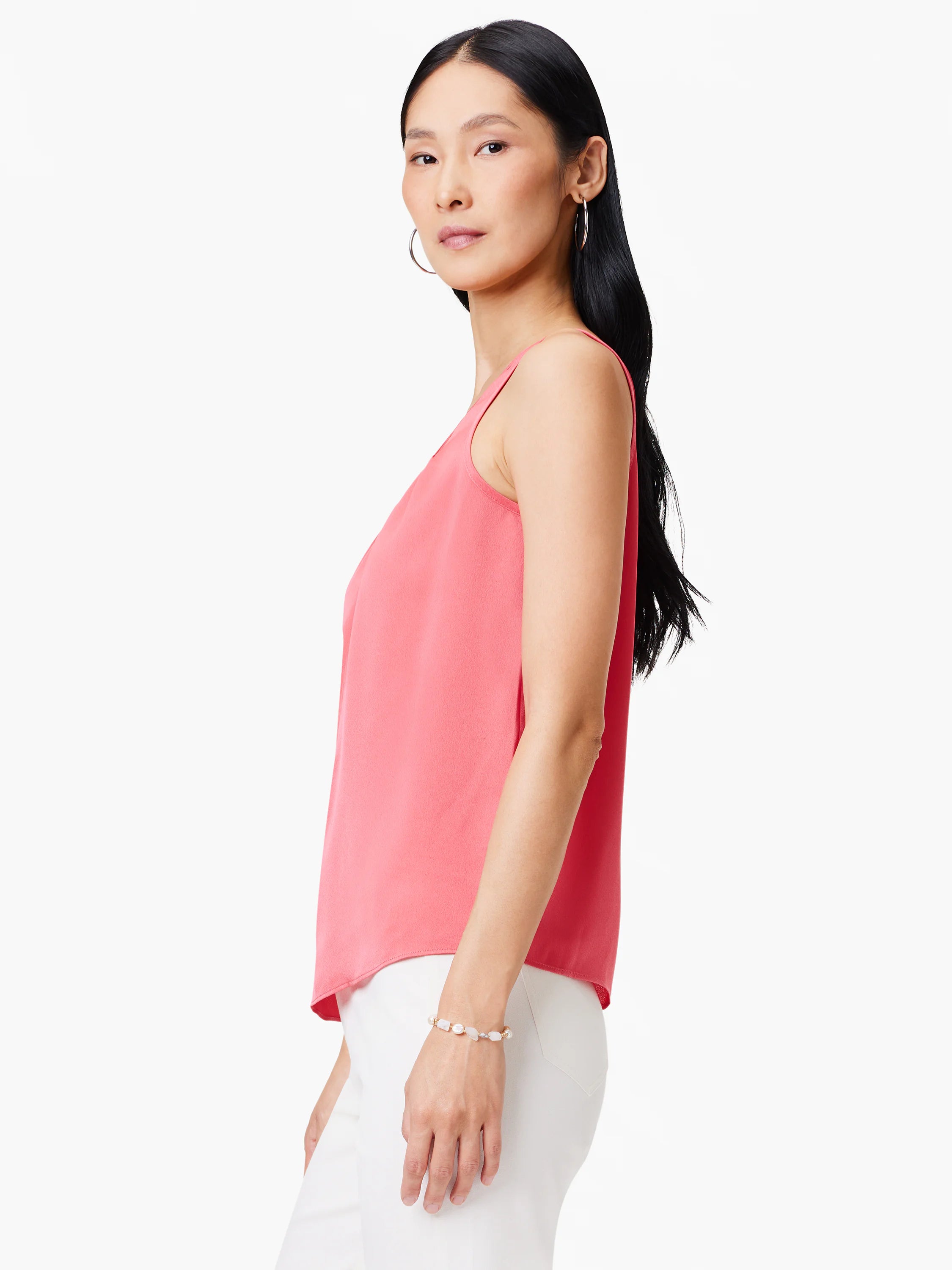Coral pink scoop tank in lightweight satin chiffon with a flowing drape.