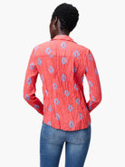 Red long-sleeve shirt with a crinkled texture and small blue embroidered patterns.  Back view.