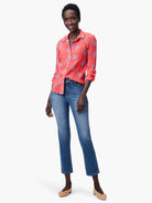 Coral shirt with blue floral pattern, long sleeves, button closure.