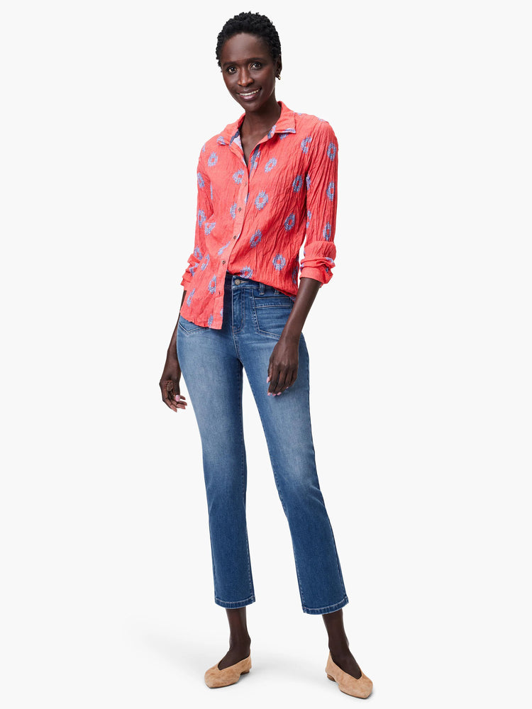 Coral shirt with blue floral pattern, long sleeves, button closure.