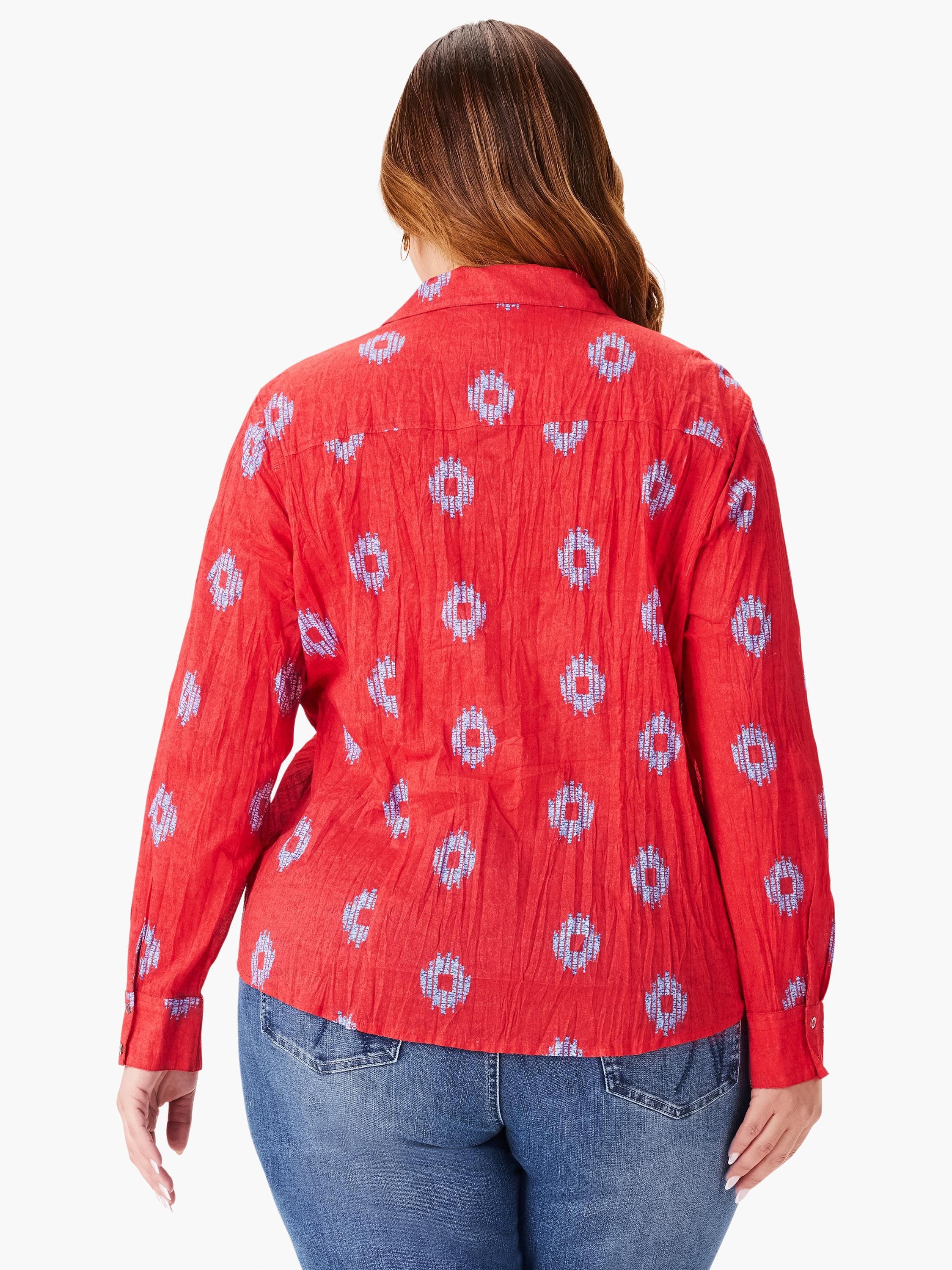 Red long-sleeve shirt with a crinkled texture and a repeating blue geometric pattern.