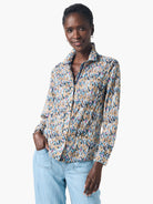 Long-sleeve button-down shirt in beige, teal, pink, and black abstract print.  Crinkled fabric.