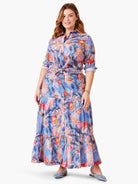 Blue crinkle shirt and maxi skirt.  Abstract floral print in blue, pink, and red hues.  Shirt is button-down, belted at...