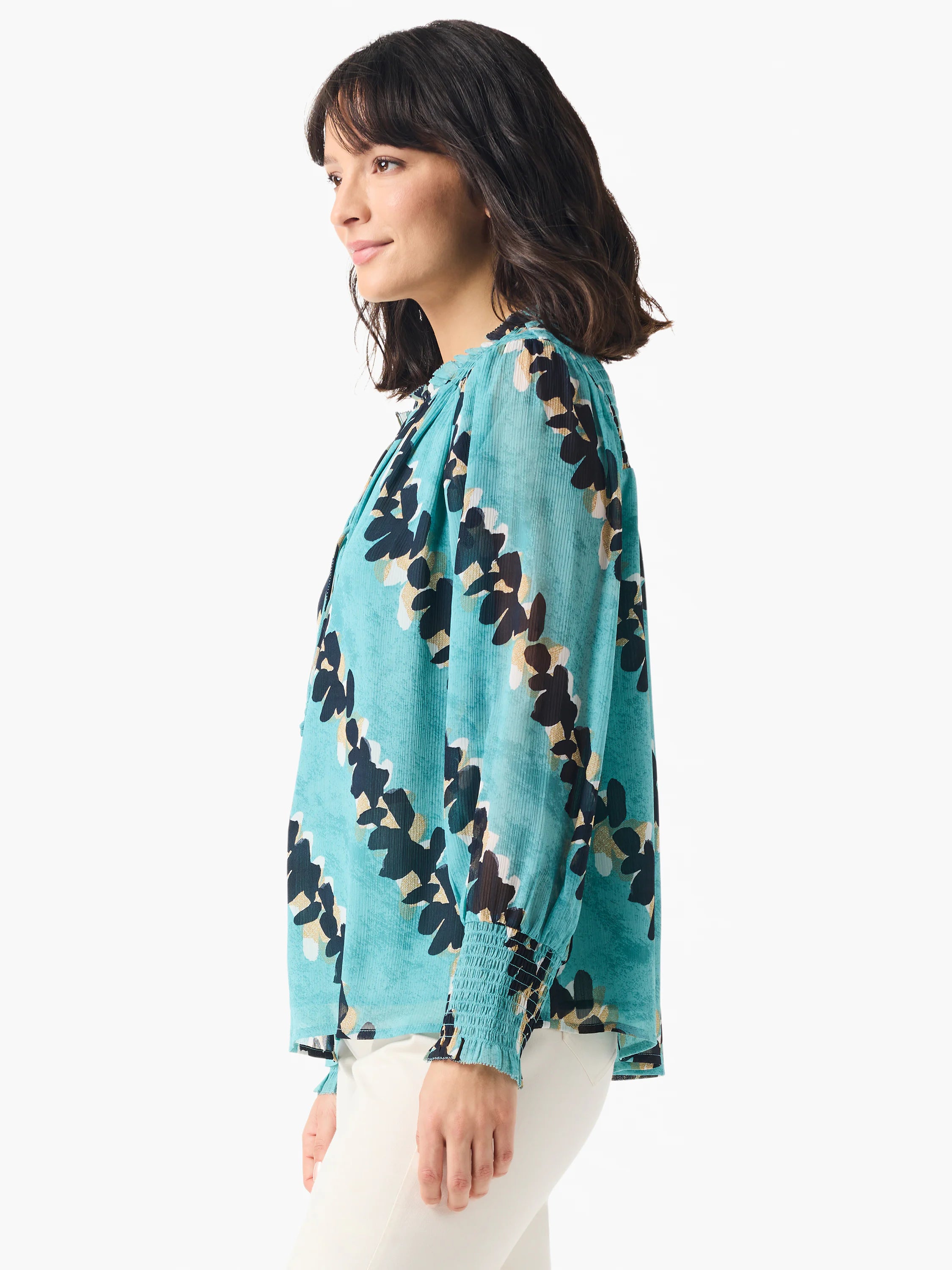 Teal long-sleeve blouse with a dark-navy and gold abstract leaf print.  Elastic cuffs.