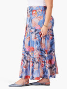 Blue tiered maxi skirt with red, pink & peach floral print.  Three tiers.