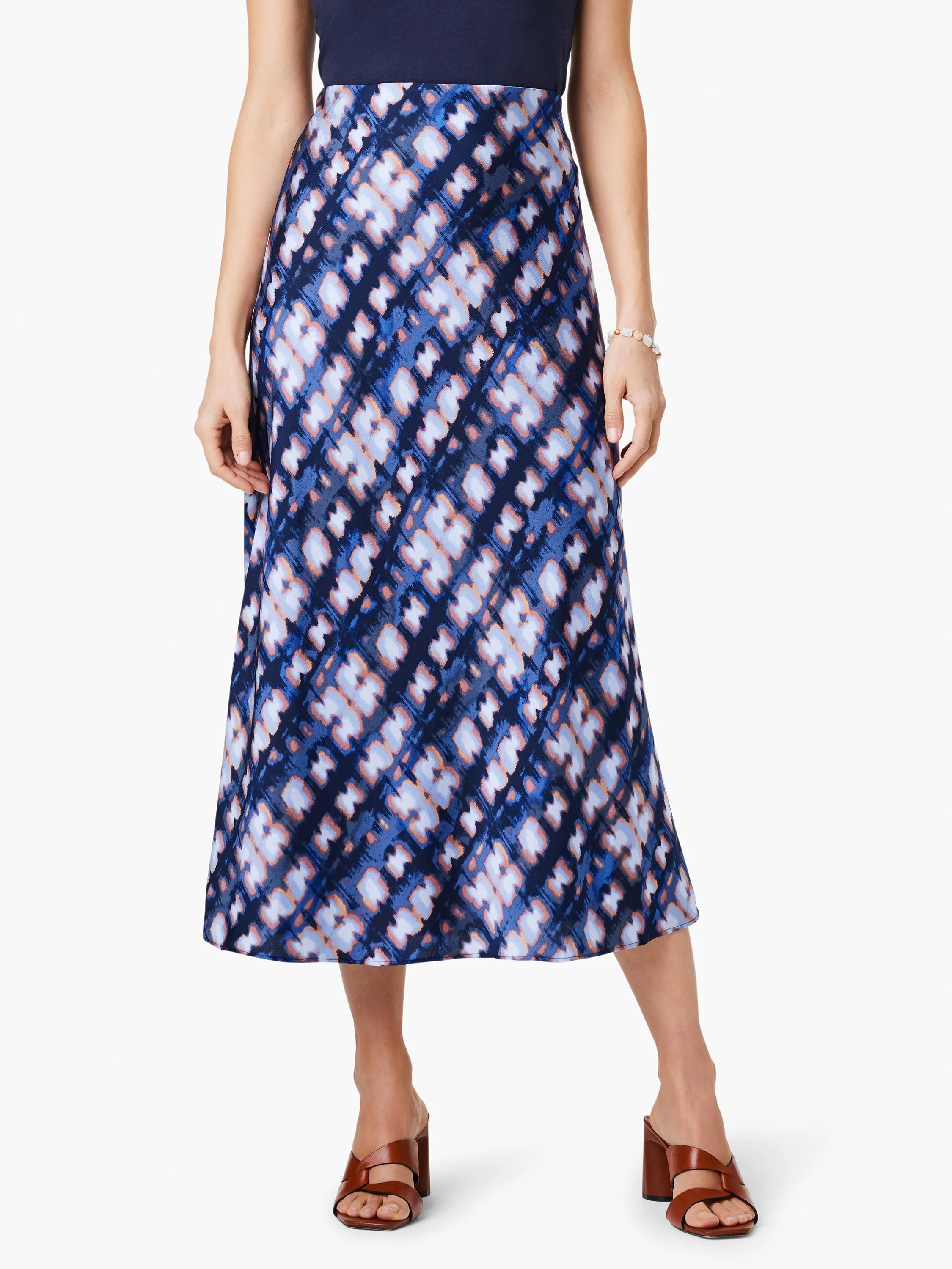 Mid-length A-line slip skirt in blue, purple, and white diagonal pattern.