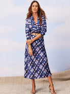 Mid-length slip skirt in blue, white, and brown abstract print.  Bias cut.