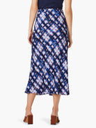 Midi slip skirt, blue, lavender, and brown shibori-style print.  A-line silhouette.