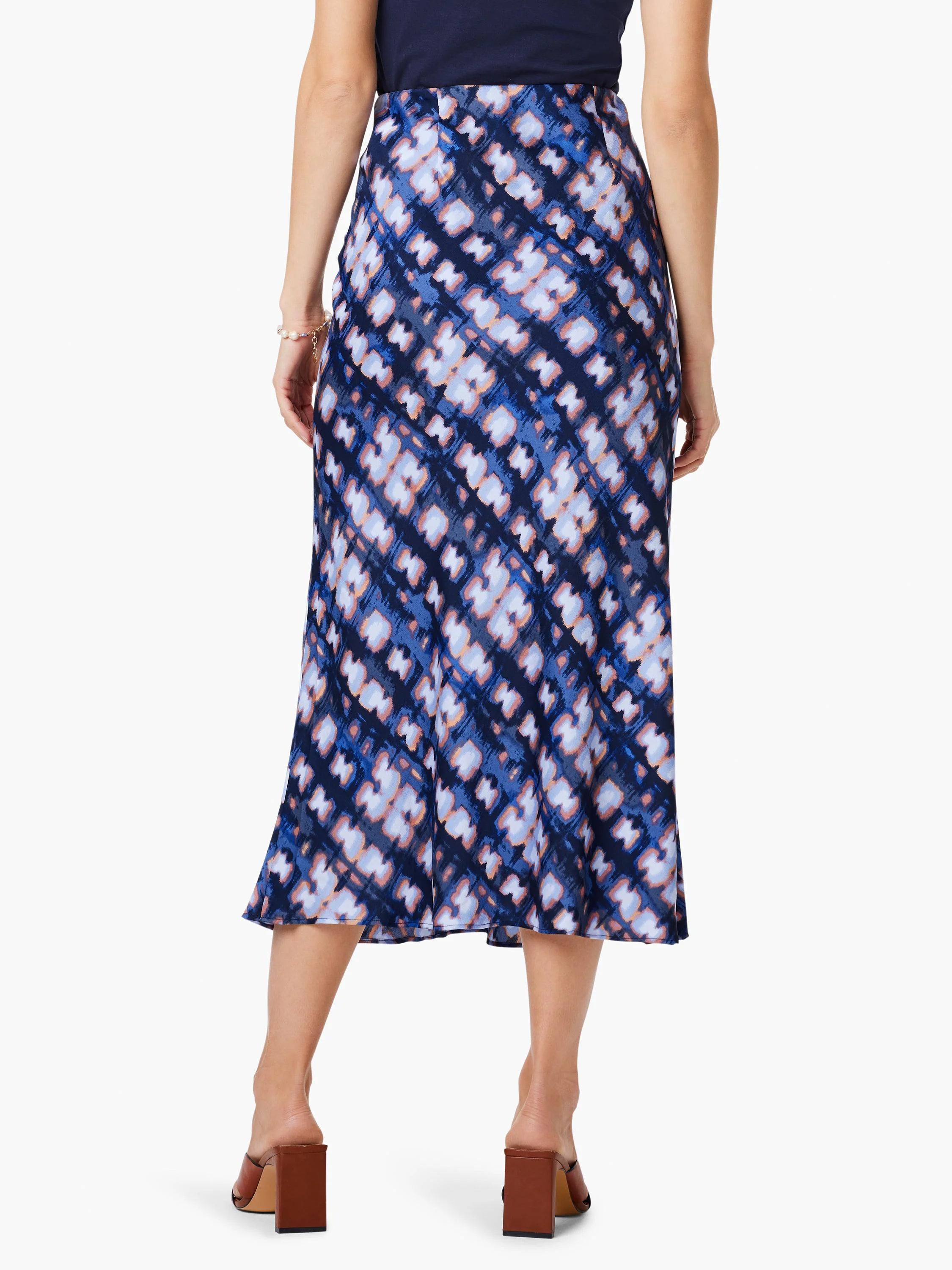 Midi slip skirt, blue, lavender, and brown shibori-style print.  A-line silhouette.