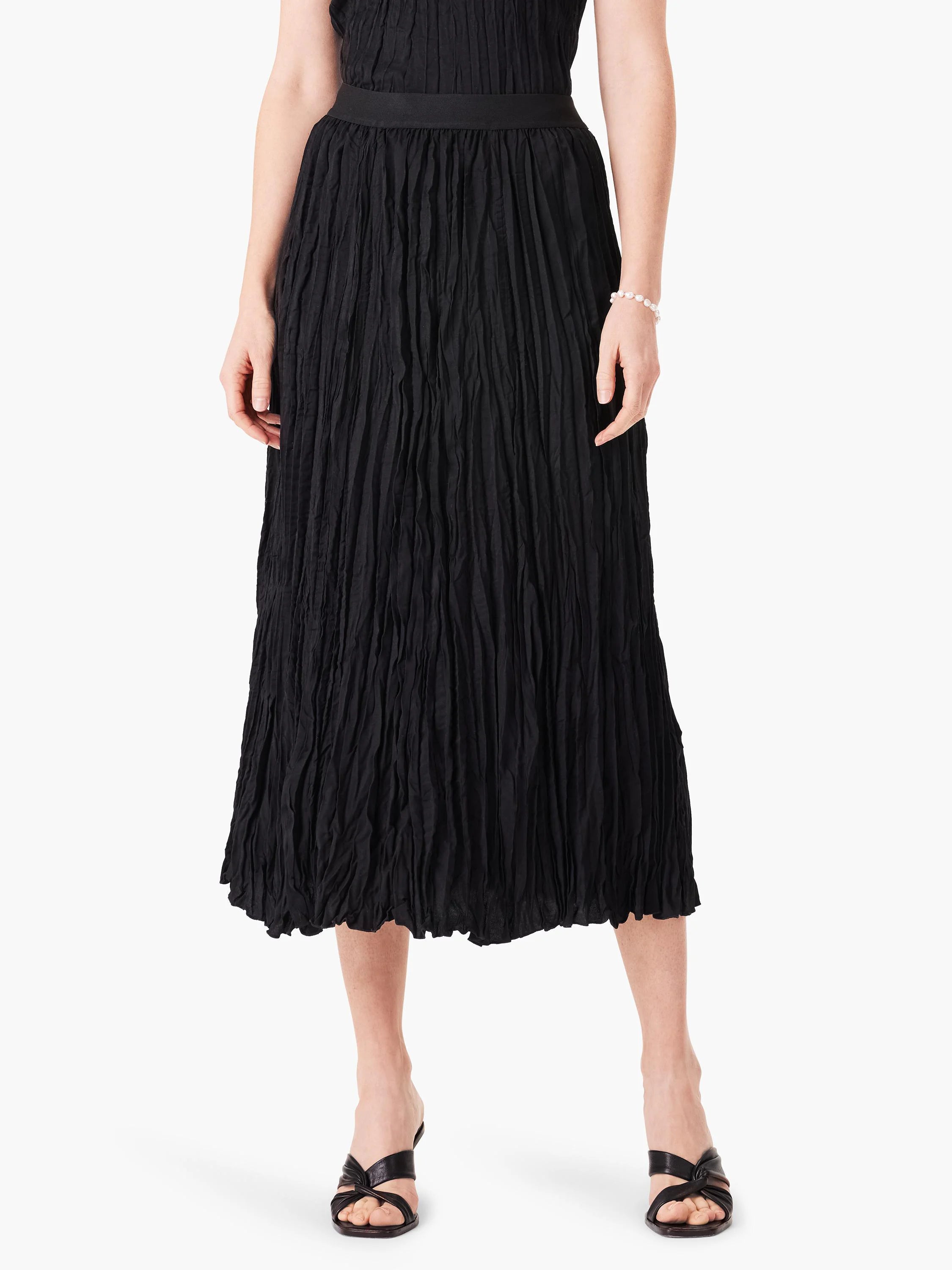 Black, midi-length skirt with a strong crinkled texture throughout and a flat waistband.
