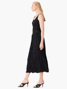 Black midi skirt with an irregular, vertical crinkled texture.